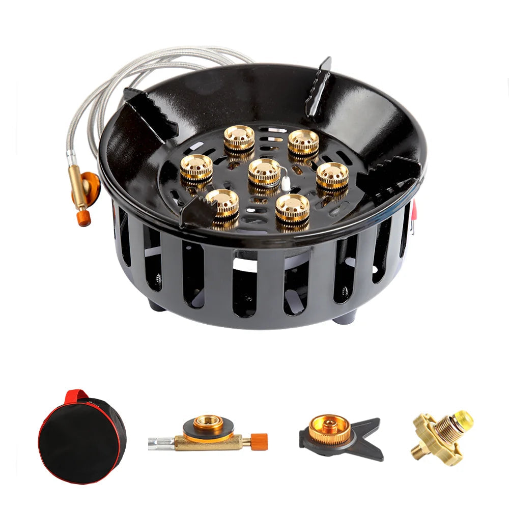 Black gas stove burner with gold components on a white background