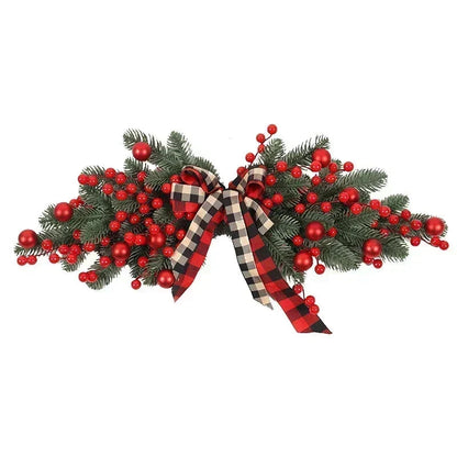 Decorative Christmas swag with red berries and plaid ribbons on a white background