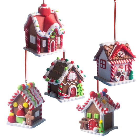 Set of five gingerbread house ornaments on a white background