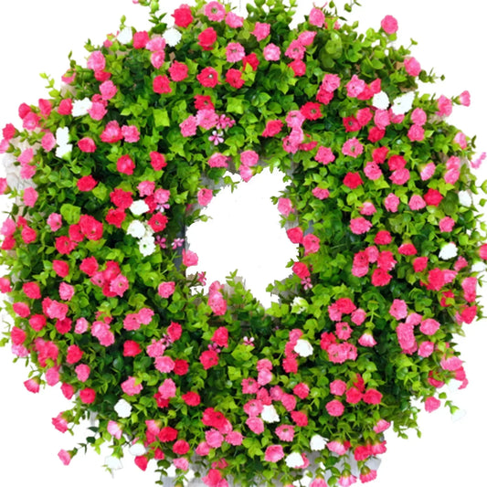 Floral wreath with pink, white, and green flowers on a white background
