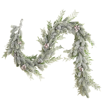 Decorative wreath with greenery and small pink flowers on a light background