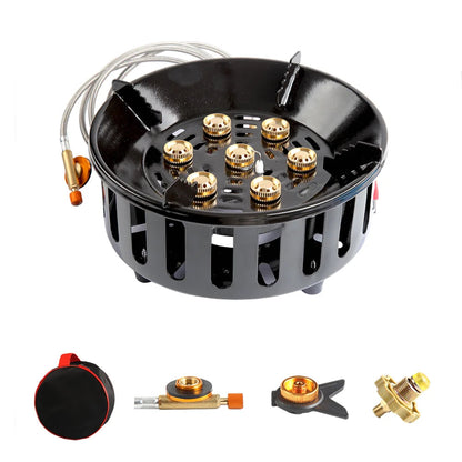 Black gas stove burner with gold components on a white background
