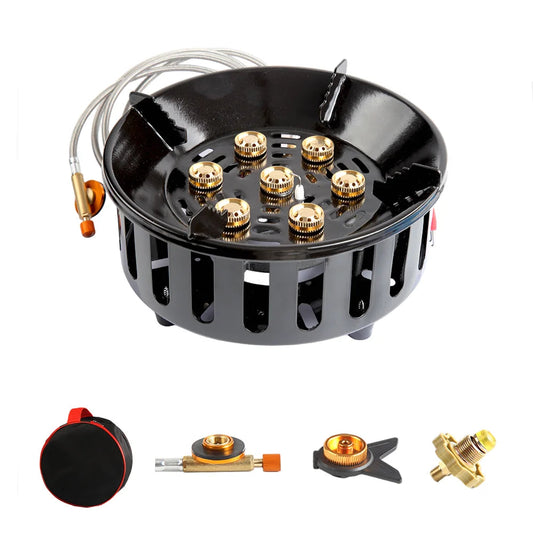 Black gas stove burner with gold components on a white background