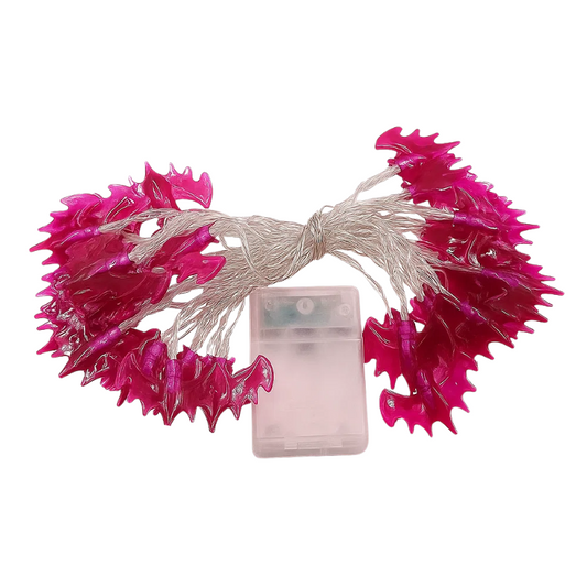 String lights with pink flower-shaped bulbs and a battery pack on a white background